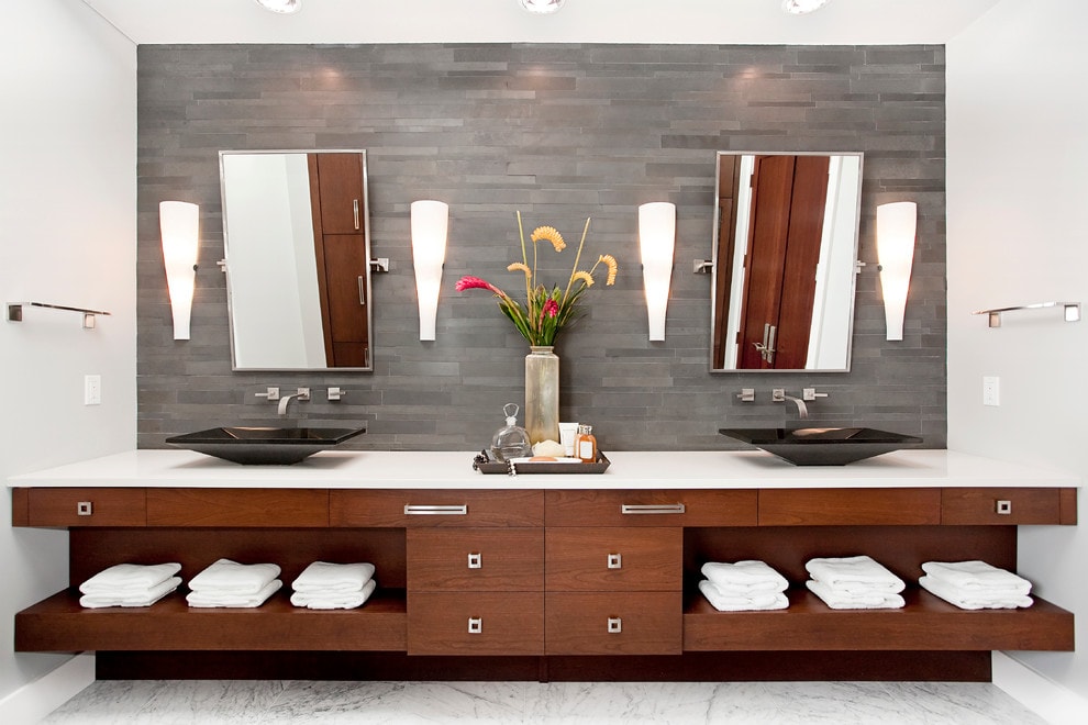 Norstone Grey Basalt Lynia Interlocking Tile featured on the backsplash of a vanity of modern spa inspired bathroom